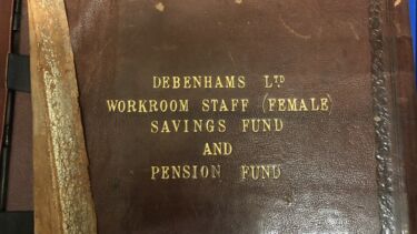 An old weathered leather book with the text 'Debenham Ltd Workroom Staff (Female) Savings Fund and Pension Fund' on the cover