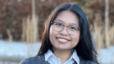 Student Danica Bautista stood in front of trees