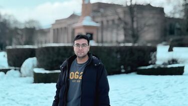 Harsh Patni standing outside in front of a building