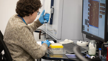 A researcher using a pippet 