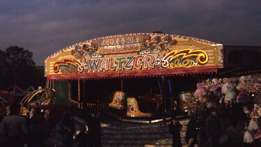 Colourful waltzer fairground ride