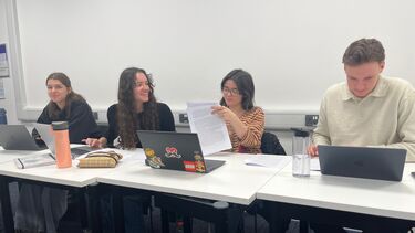 Four students working together