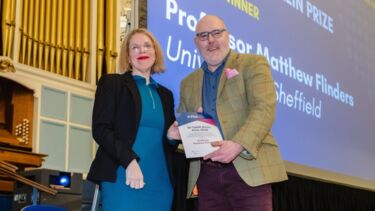 Matt Flinders poses with a certificate at the PSA awards