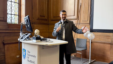 A Postrgraduate student presenting in Mappin Hall