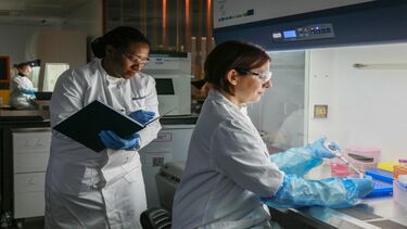 A pair of female scientists working in a lab