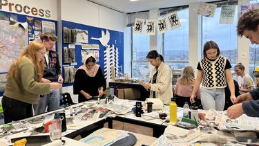 Group of MArch students working in Arts Tower studio using collage 