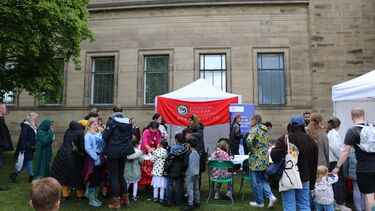 Crowd of people at SCI tent at the May Fayre 