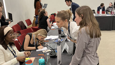 Students debating at a model NATO