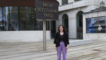 Natalie stands in front of the New Scotland Yard sign