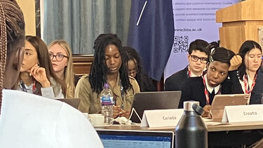 Students listening to speech at Model NATO