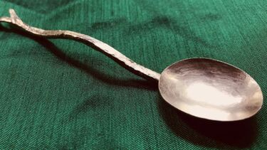 Spoon on green table