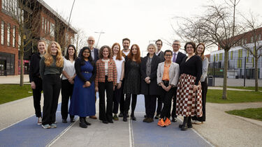 Members of the SMART-Health team pose near the Advanced Wellbeing Research Centre.