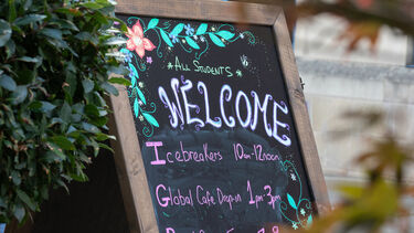 A chalk board with written details of Orientation Week events