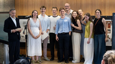 Student prize winners awarded certificates smiling 