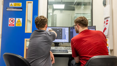Image of people using a computer linked to Ava