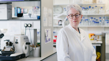 Orla Gallagher standing in a laboratory