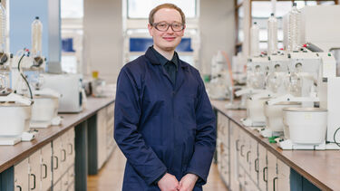 Simon Parker stood in a Chemistry Laboratory. 