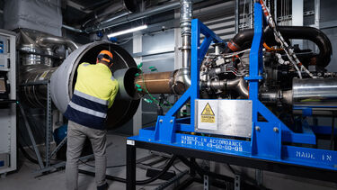 An engineer is working with some high tech aviation fuel testing equipment