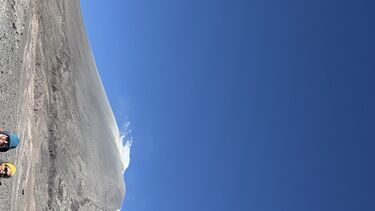 Four people pose outside Lastarria volcano in Chile 