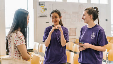 Student ambassadors talking at a pre-application open day event