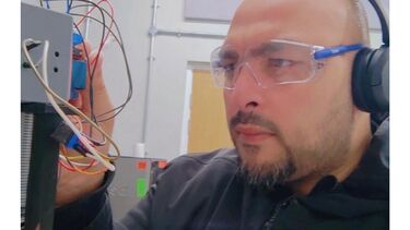 Single-droplet combustion rig at the ignition system and high-speed camera used for the iron-fuel experiments