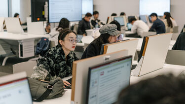 Students sitting at computer desks