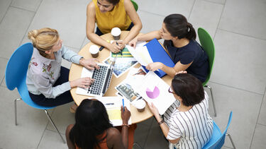 A group of women working at a table