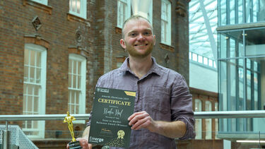 Man holding certificate in the Heartspace