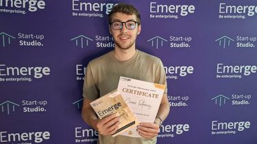 Man holding certificate in Start-up Studio