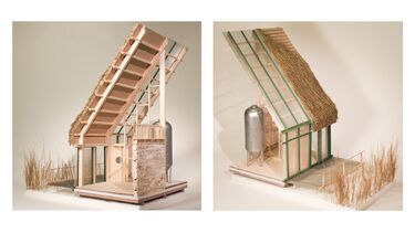A model of a metal tank and other materials covered by a suspended high roof outside