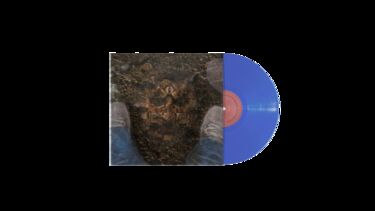 A blue vinyl record in a sleeve with an image of a face appearing from dirt between two shoes