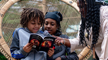 Young people enjoying a book