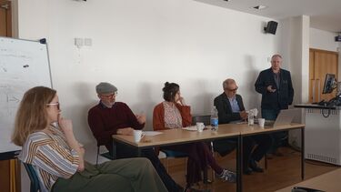 A panel of 5 - 3 men and 2 women
