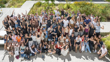large group of people photographed from above with a drone