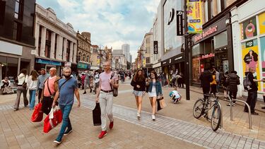 A UK high street with pedestrians