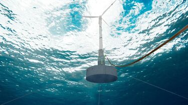 A floating wind turbine in the ocean, photographed from below
