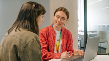 An academic adviser meets with a student