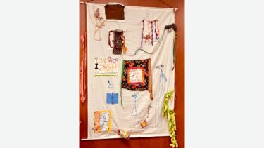 A fabric hanging with embroidery