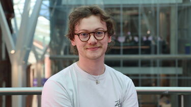 Profile of engineering student in white tshirt and glasses