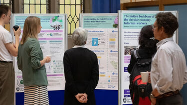 People looking at posters