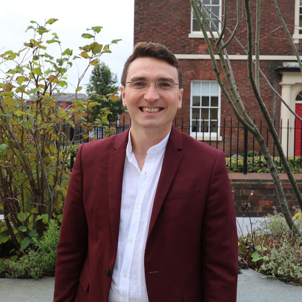 Profile picture of Joshua Forstenzer stood outside HRI building