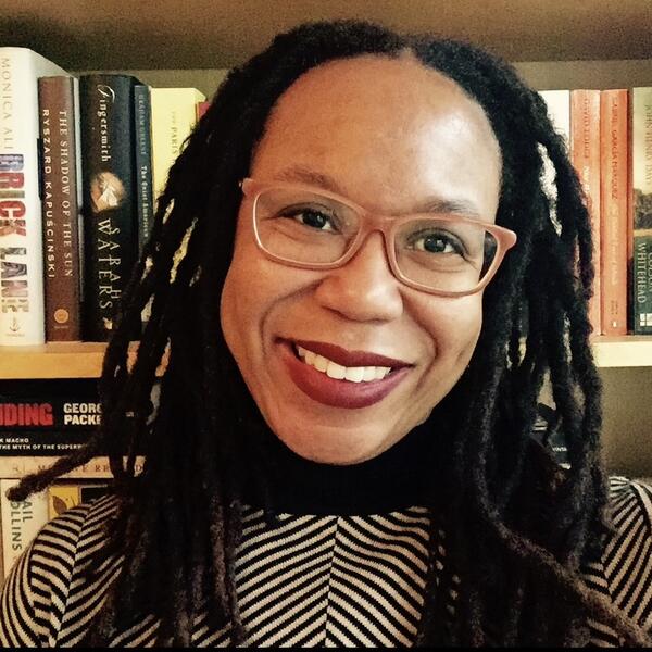 Profile picture of Professor Akwugo Emejulu in front of a bookshelf