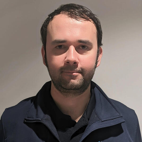 Profile picture of Headshot of male with brown hair and AMRC uniform