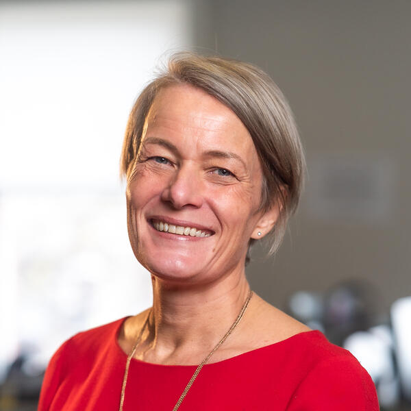 Profile picture of Portrait of a person smiling, with short straight blonde hair