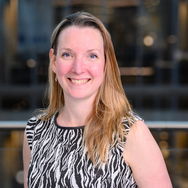 Profile picture of Portrait of a smiling academic wearing a black and white top