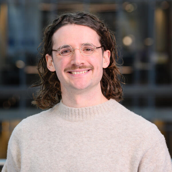 Profile picture of Researcher wearing a jumper and glasses smiling
