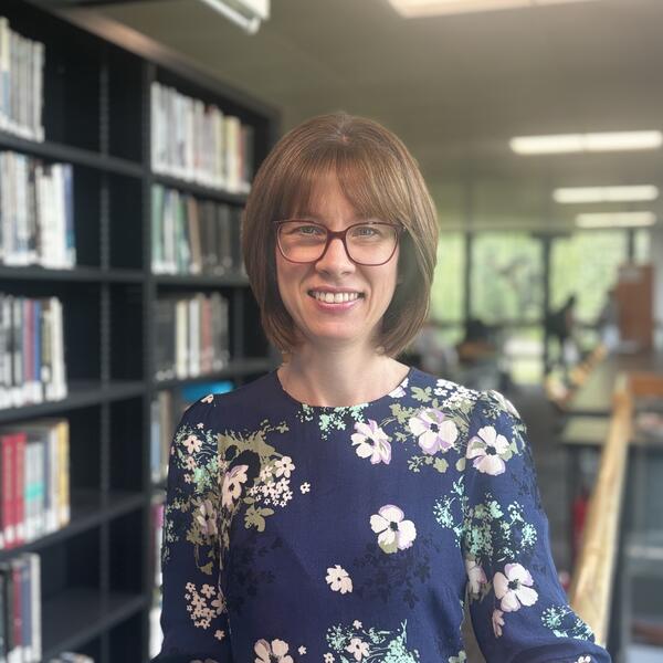 Profile picture of Emily stands in Western Bank Library 
