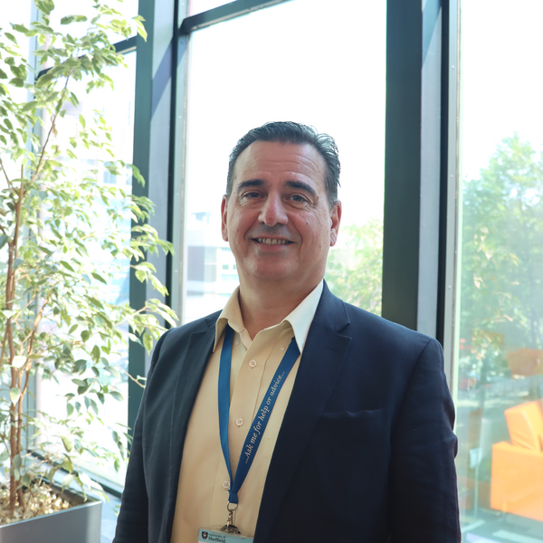 Profile picture of Gavin stands in the Research Commons 