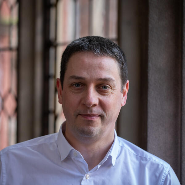 Profile picture of A person with short straight brown hair