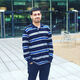 Aneeq ur Rehman. MSc Data Analytics Student. Standing outside the cafe at the student accommodation 
